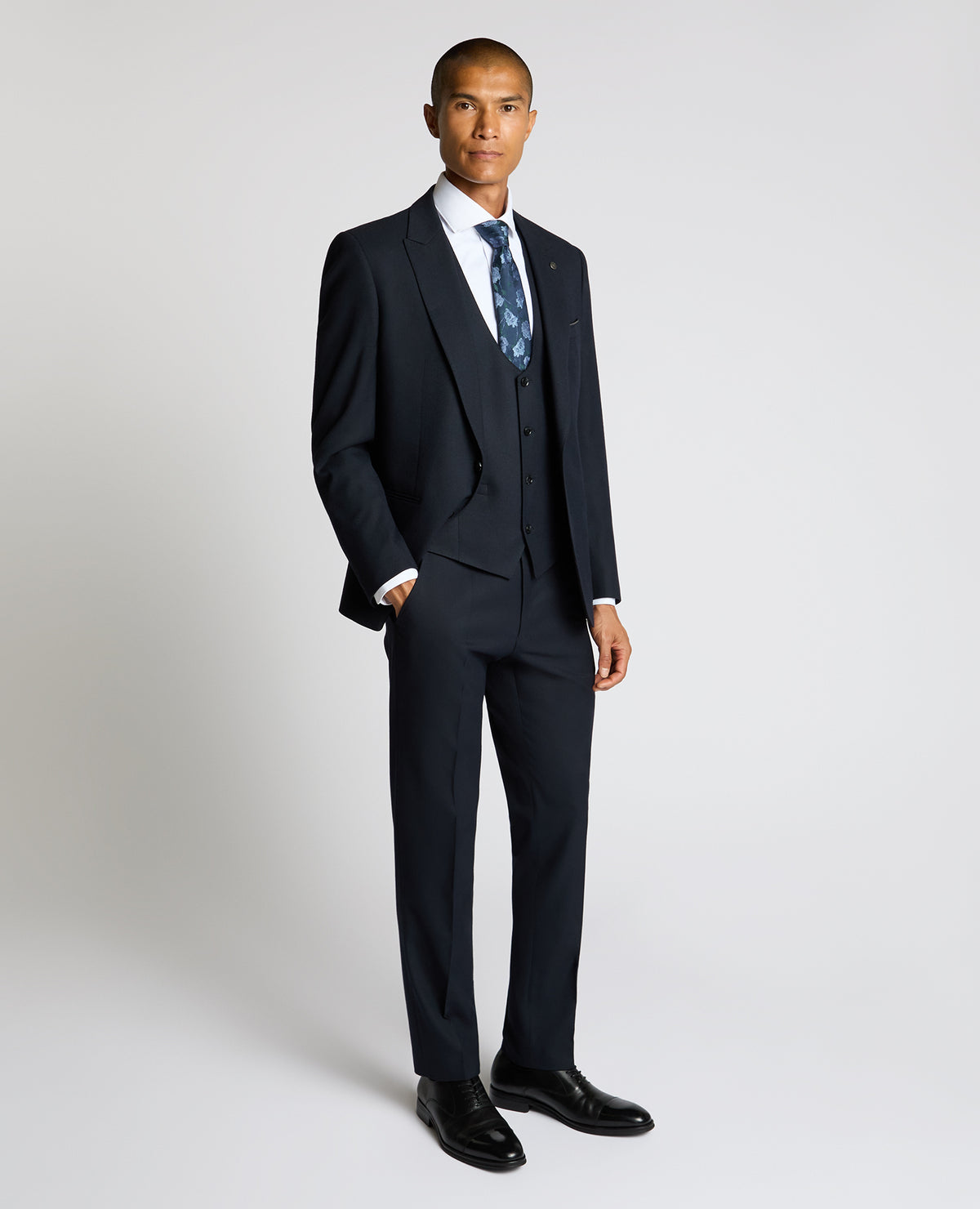 Man wearing a navy Slim Fit Stretch Waistcoat