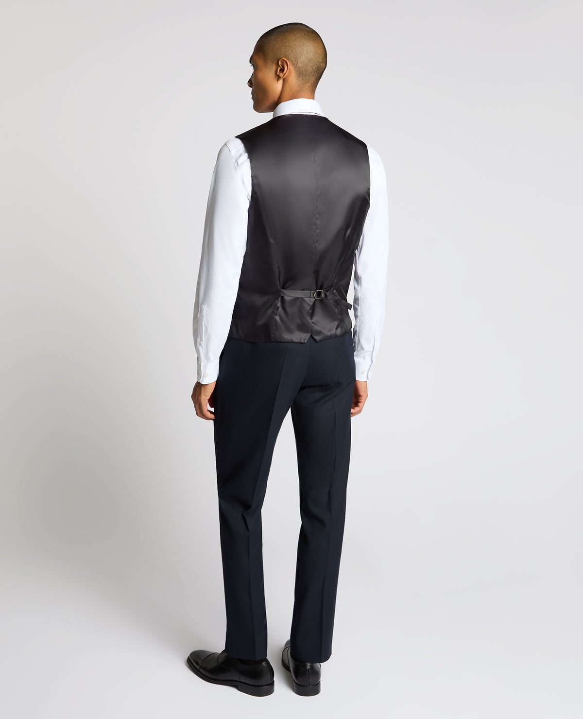 Man wearing a navy Slim Fit Stretch Waistcoat