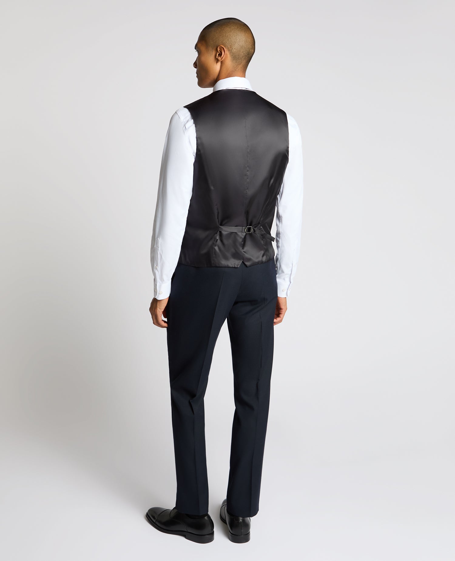 Man wearing a navy Slim Fit Stretch Waistcoat