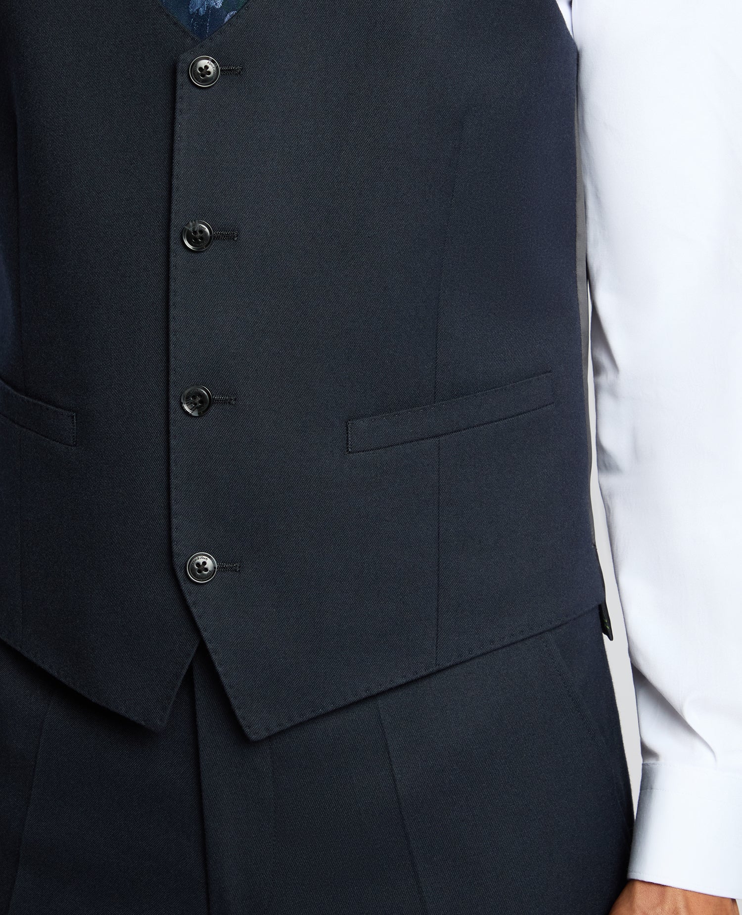 Man wearing a navy Slim Fit Stretch Waistcoat