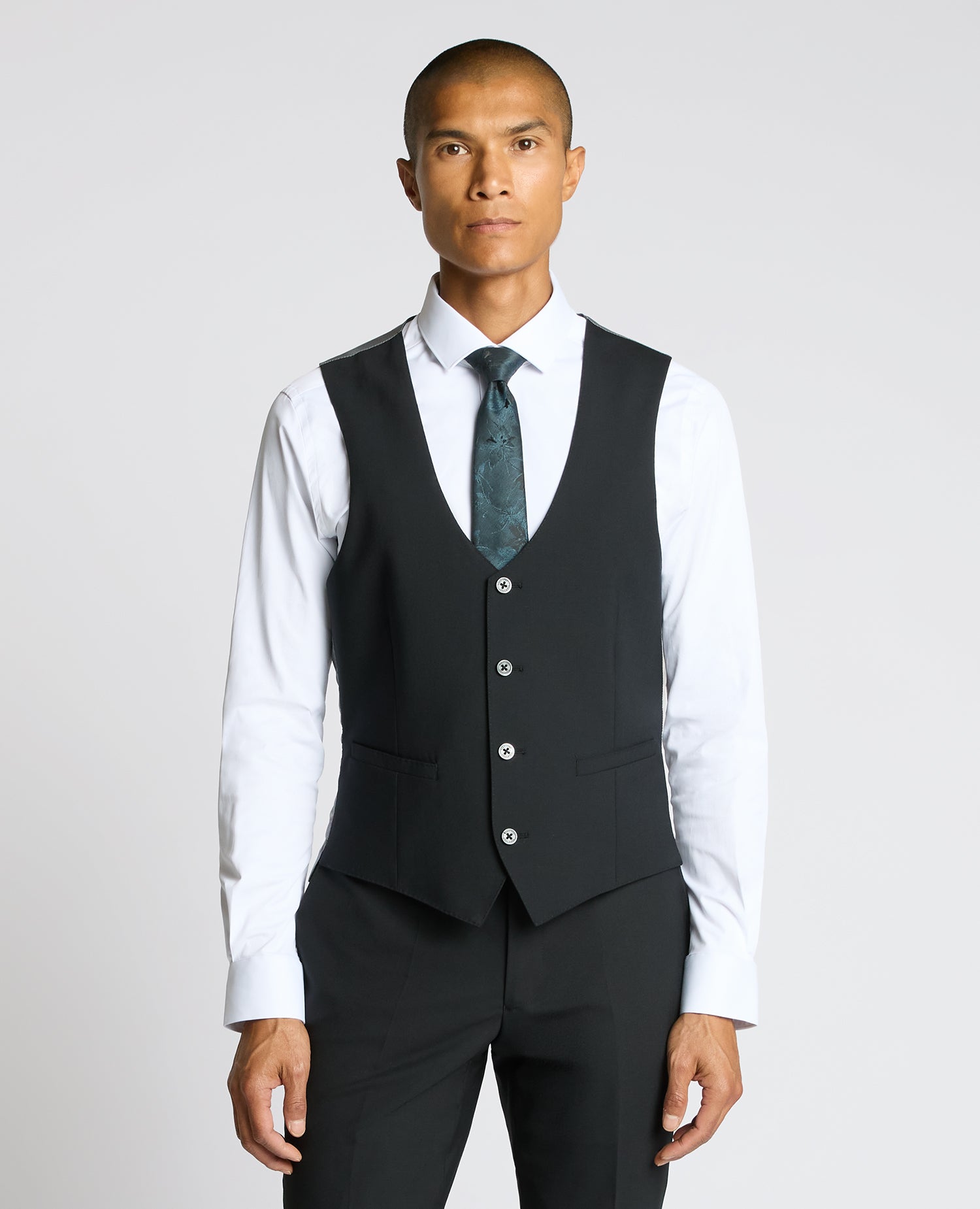 Man wearing a black Tapered Fit Black Waistcoat