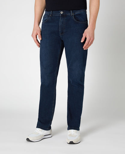 Man wearing a blue Ramsey Straight Leg Cotton-Stretch Jeans