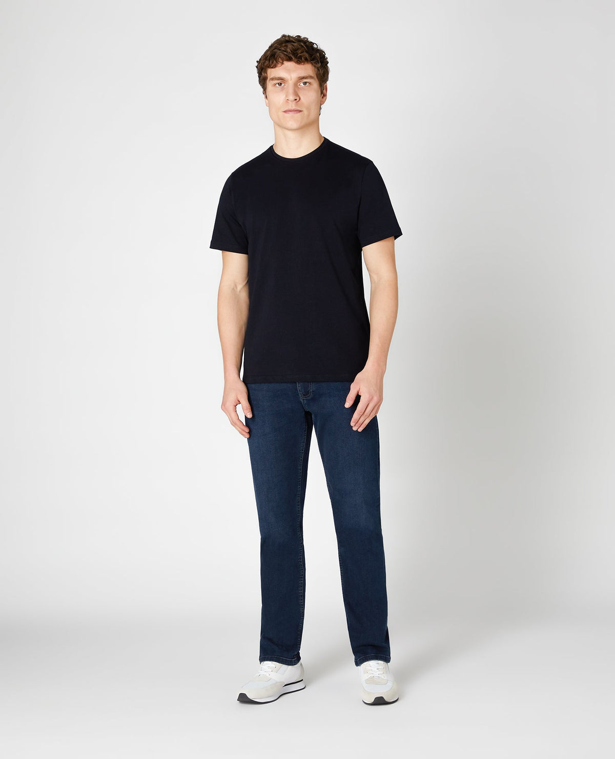 Man wearing a blue Ramsey Straight Leg Cotton-Stretch Jeans