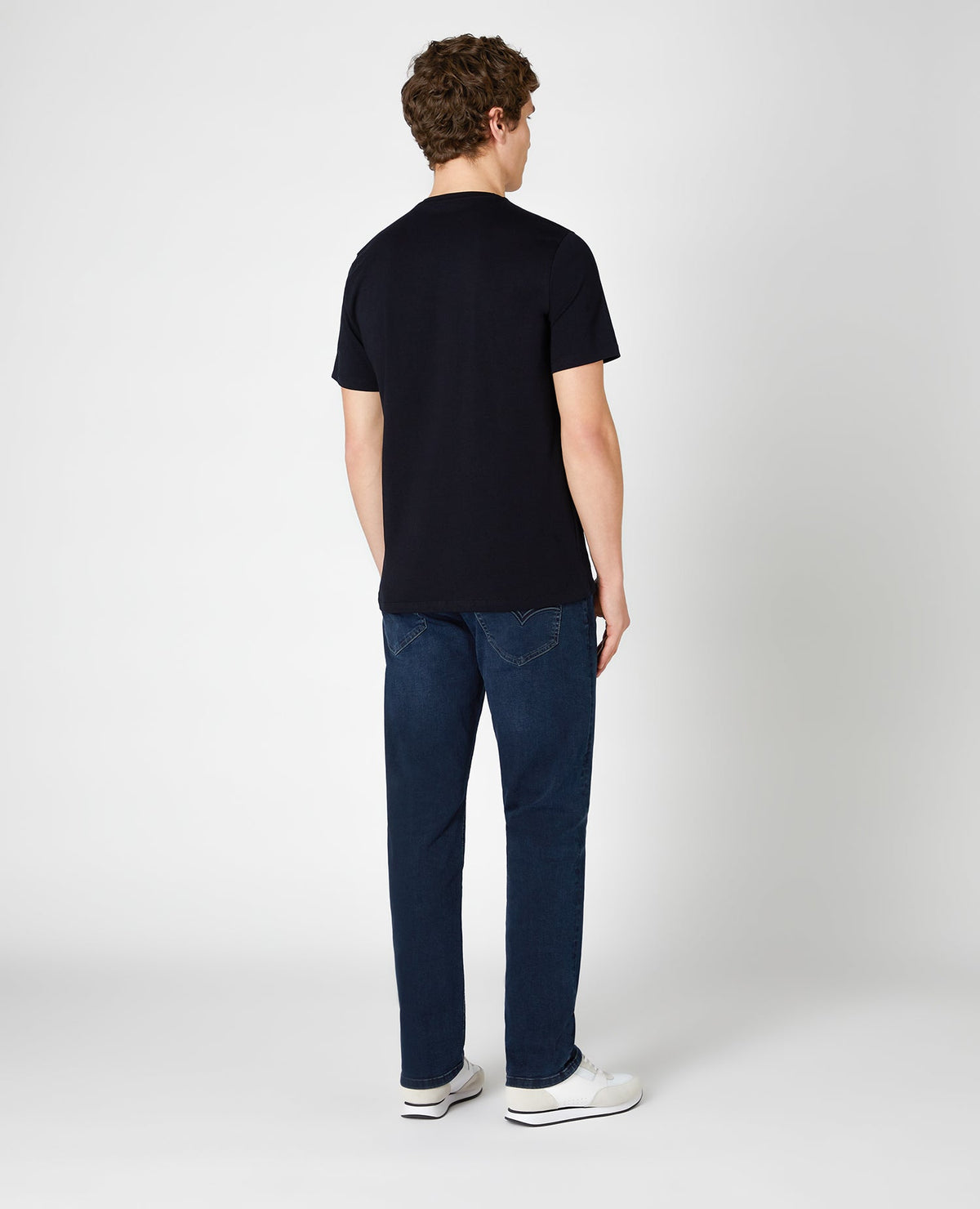 Man wearing a blue Ramsey Straight Leg Cotton-Stretch Jeans