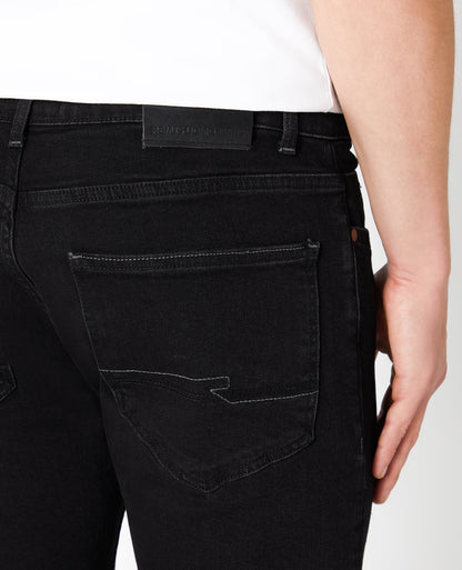 Man wearing a black Slim Fit Cotton Stretch Jeans