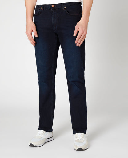 Man wearing a blue Rolston Straight Leg Cotton Stretch Jeans