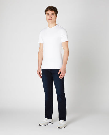 Man wearing a blue Rolston Straight Leg Cotton Stretch Jeans