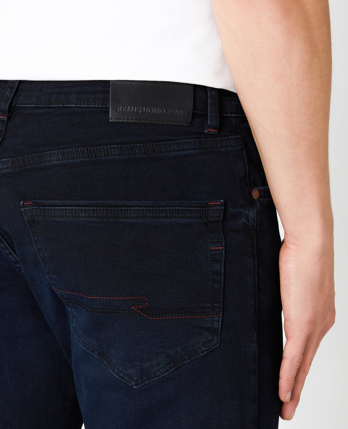 Man wearing a blue Rolston Straight Leg Cotton Stretch Jeans
