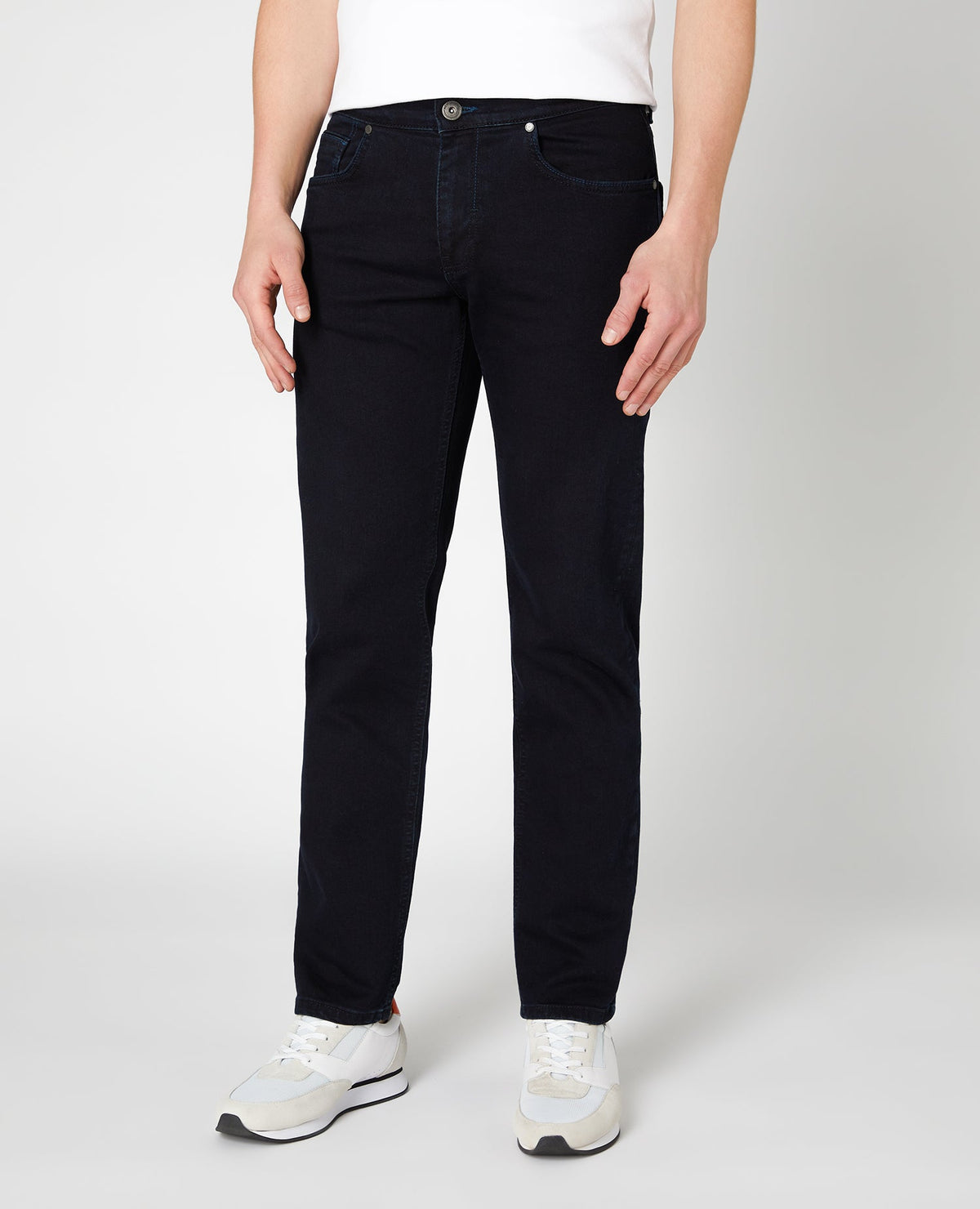 Man wearing a navy Rolston Straight Leg Cotton Stretch Jeans