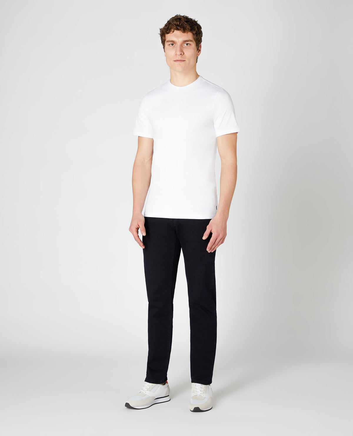 Man wearing a navy Rolston Straight Leg Cotton Stretch Jeans