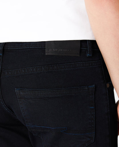 Man wearing a navy Rolston Straight Leg Cotton Stretch Jeans