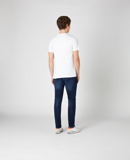 Man wearing a blue X-Slim Fit Cotton-Stretch Jean