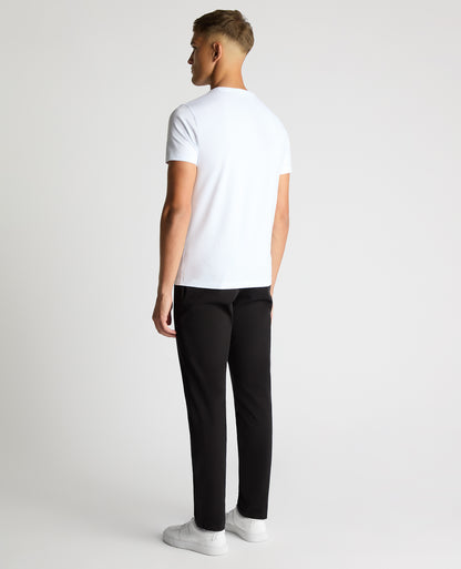 Man wearing a black Slim Leg Cotton-Stretch Chino
