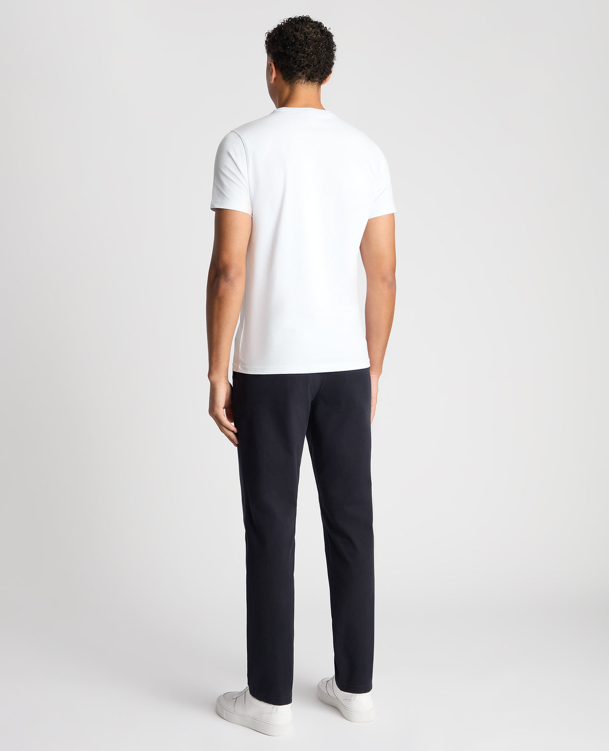 Man wearing a navy Slim Leg Cotton-Stretch Chino