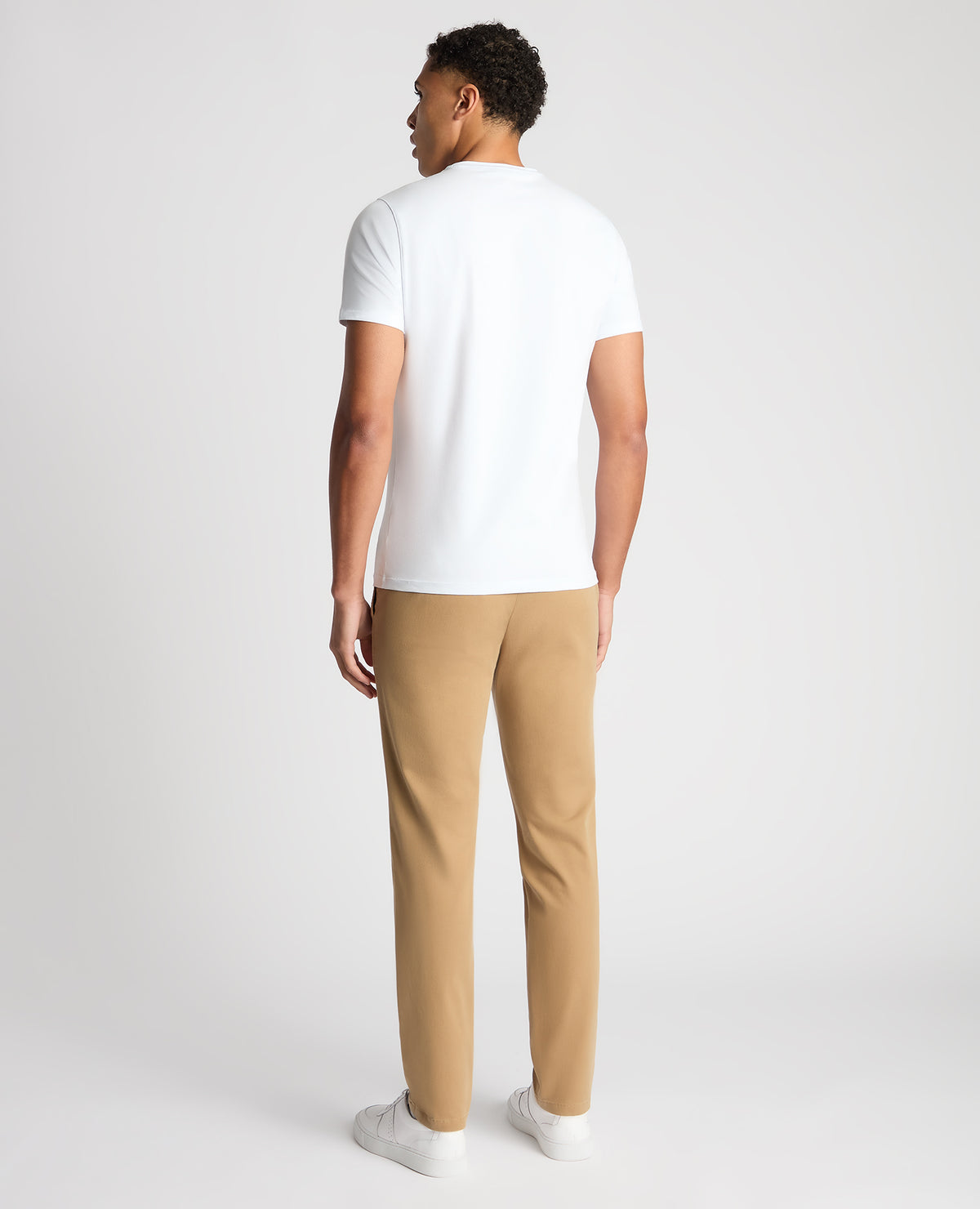 Man wearing a sand Slim Fit Cotton-Stretch Washed Chino