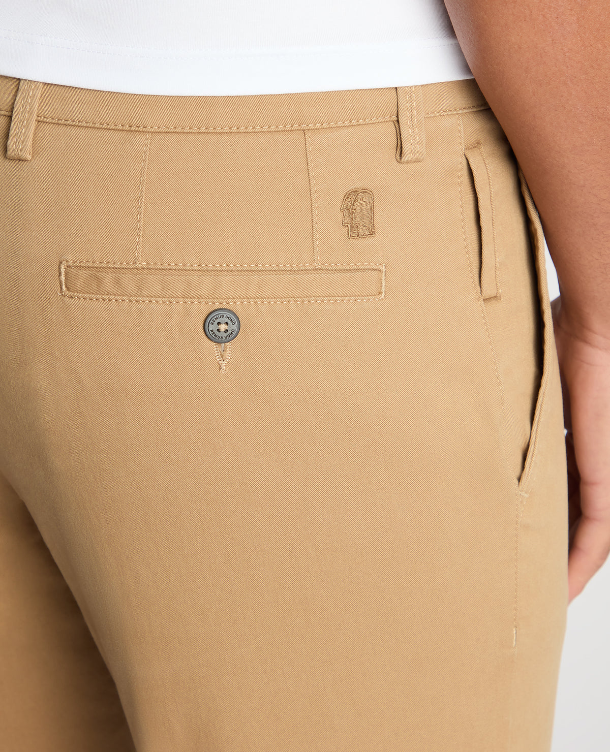 Man wearing a sand Slim Fit Cotton-Stretch Washed Chino