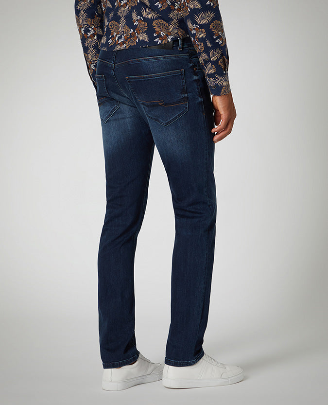 Man wearing a blue Slim Leg Cotton Power Stretch Jean