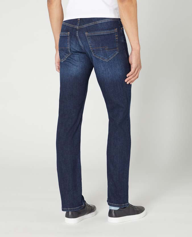 Man wearing a navy Rogan Straight Leg Cotton-Stretch Jean