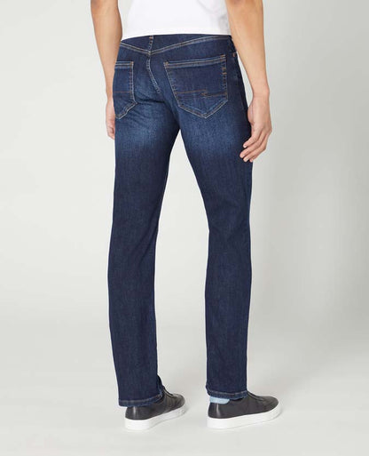 Man wearing a navy Rogan Straight Leg Cotton-Stretch Jean