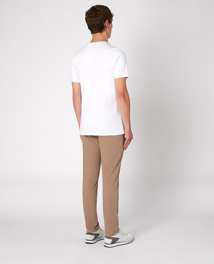 Man wearing a sand X-Slim Leg Cotton-Stretch Chino