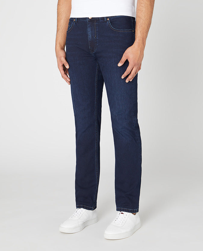Man wearing a navy Rogan Straight Leg Cotton Power Stretch Jeans