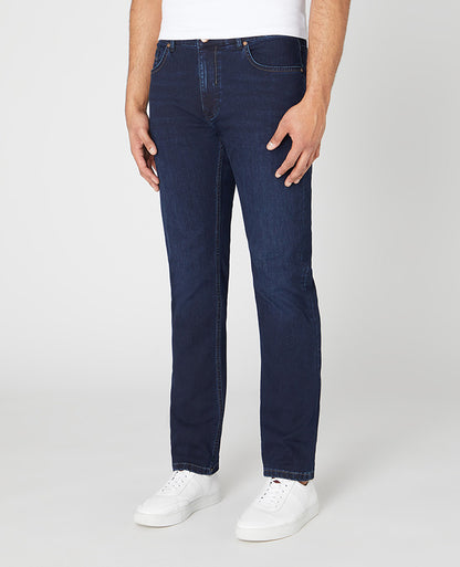 Man wearing a navy Rogan Straight Leg Cotton Power Stretch Jeans