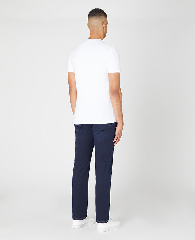 Man wearing a navy Rogan Straight Leg Cotton Power Stretch Jeans