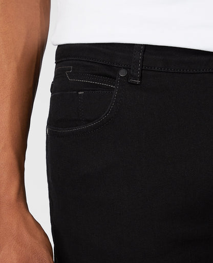 Man wearing a black Apollo Slim Leg Cotton Power Stretch Jeans