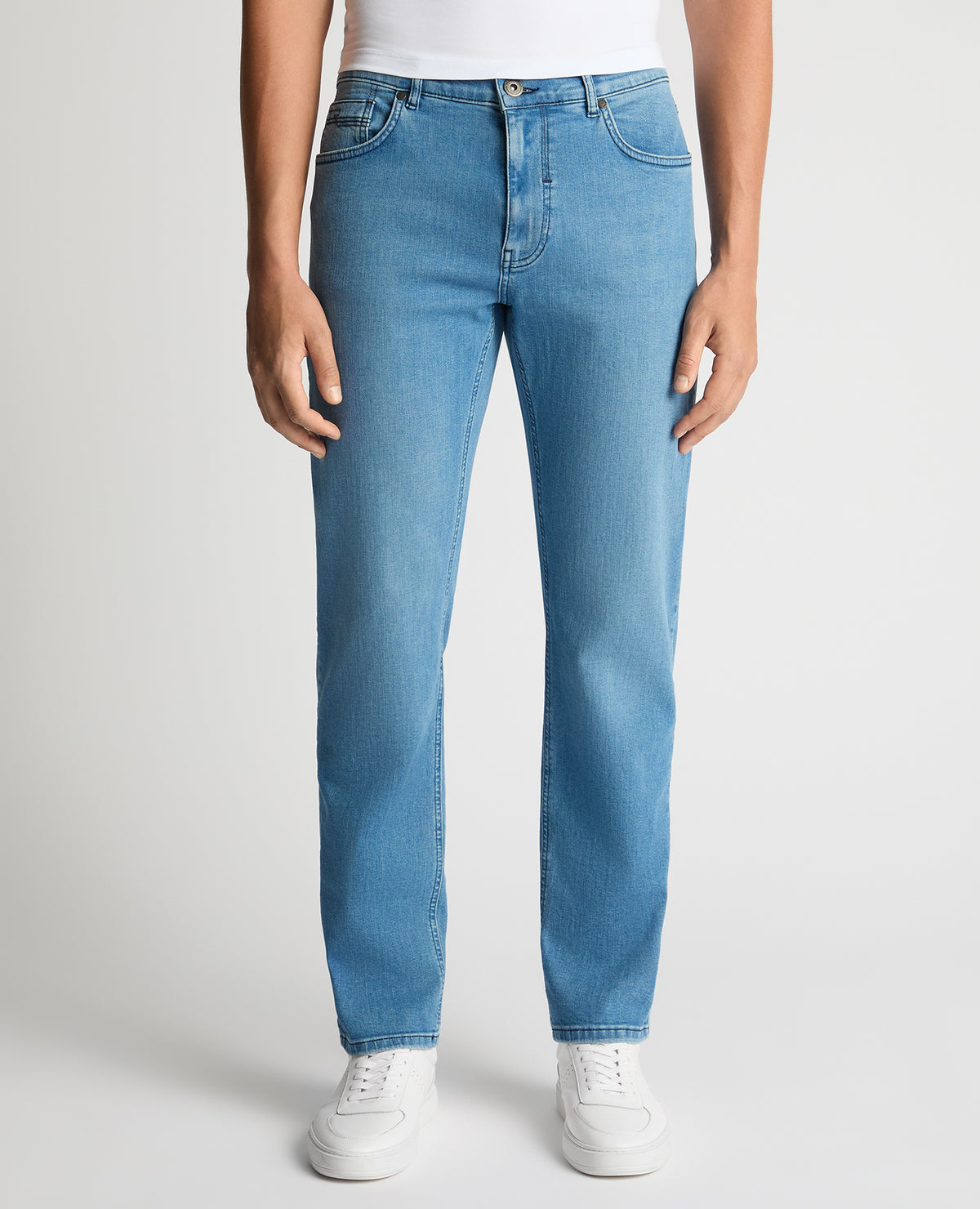 Man wearing a blue Rogan Straight Leg Eco Cotton-Stretch Jeans