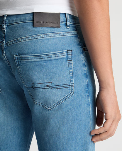 Man wearing a blue Rogan Straight Leg Eco Cotton-Stretch Jeans