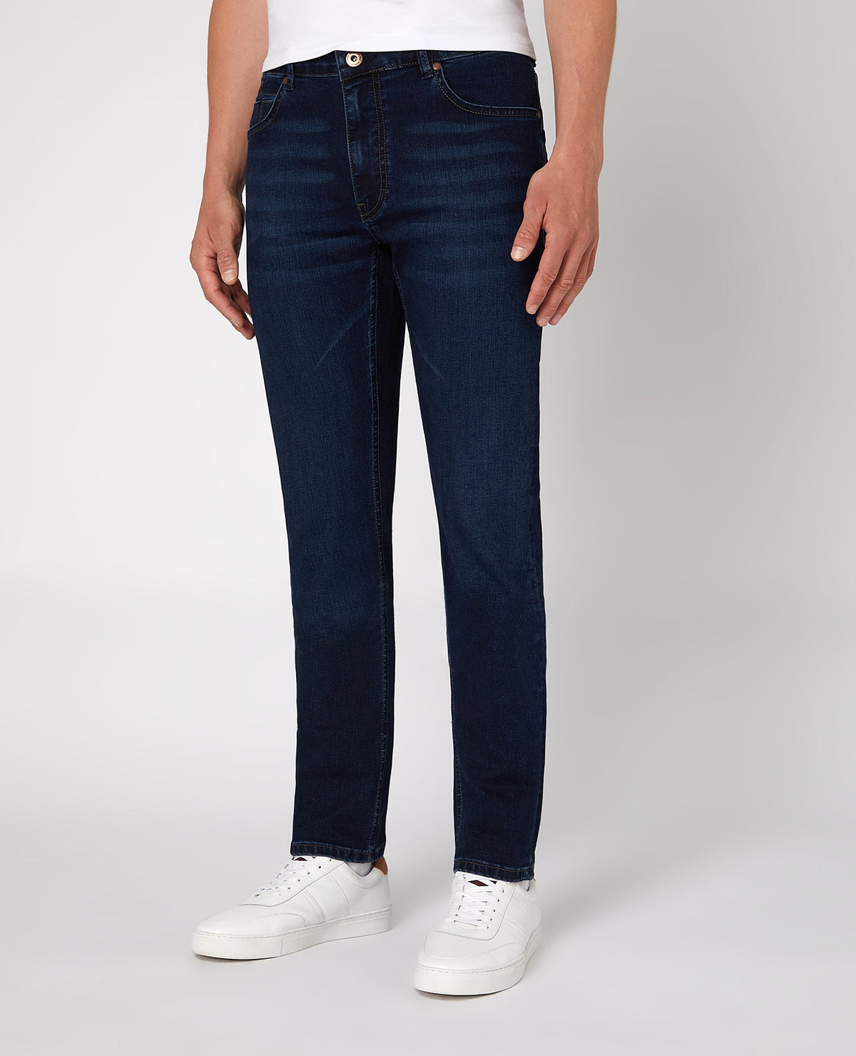 Man wearing a navy Apollo Slim Leg Cotton Power Stretch Jean