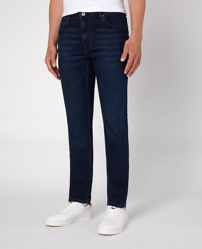 Man wearing a navy Apollo Slim Leg Cotton Power Stretch Jean