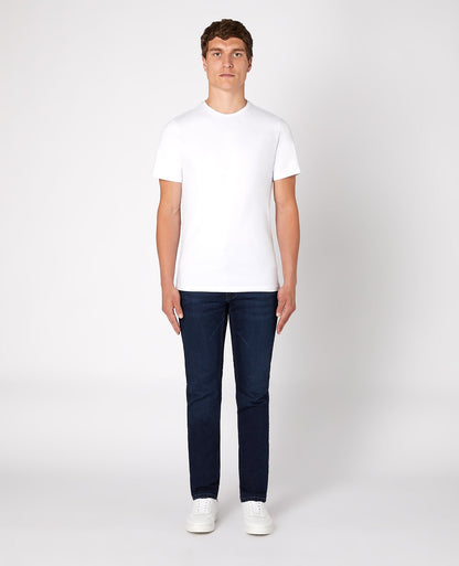 Man wearing a navy Apollo Slim Leg Cotton Power Stretch Jean