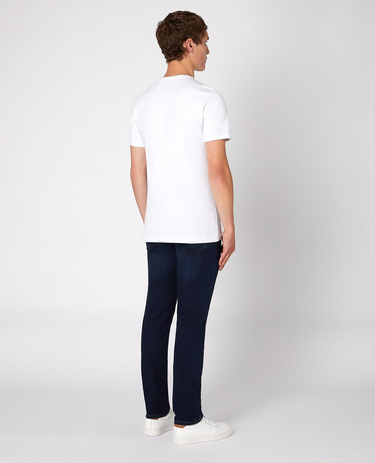Man wearing a navy Apollo Slim Leg Cotton Power Stretch Jean