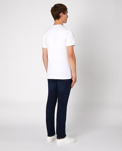 Man wearing a navy Apollo Slim Leg Cotton Power Stretch Jean