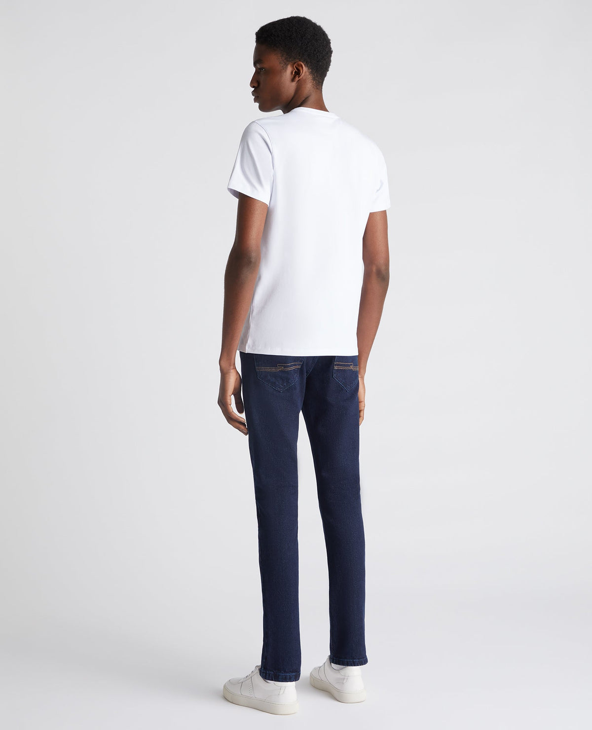 Man wearing a navy Slim Leg Comfort Stretch Jean