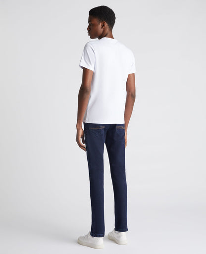 Man wearing a navy Slim Leg Comfort Stretch Jean