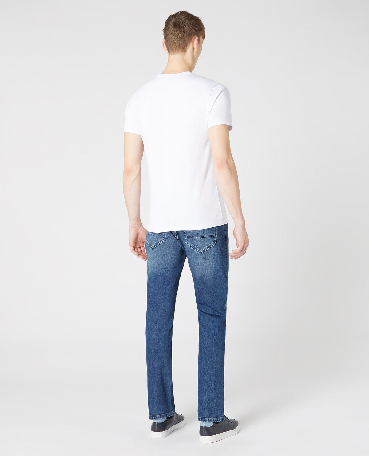 Man wearing a blue Slim Leg Comfort Stretch Jean
