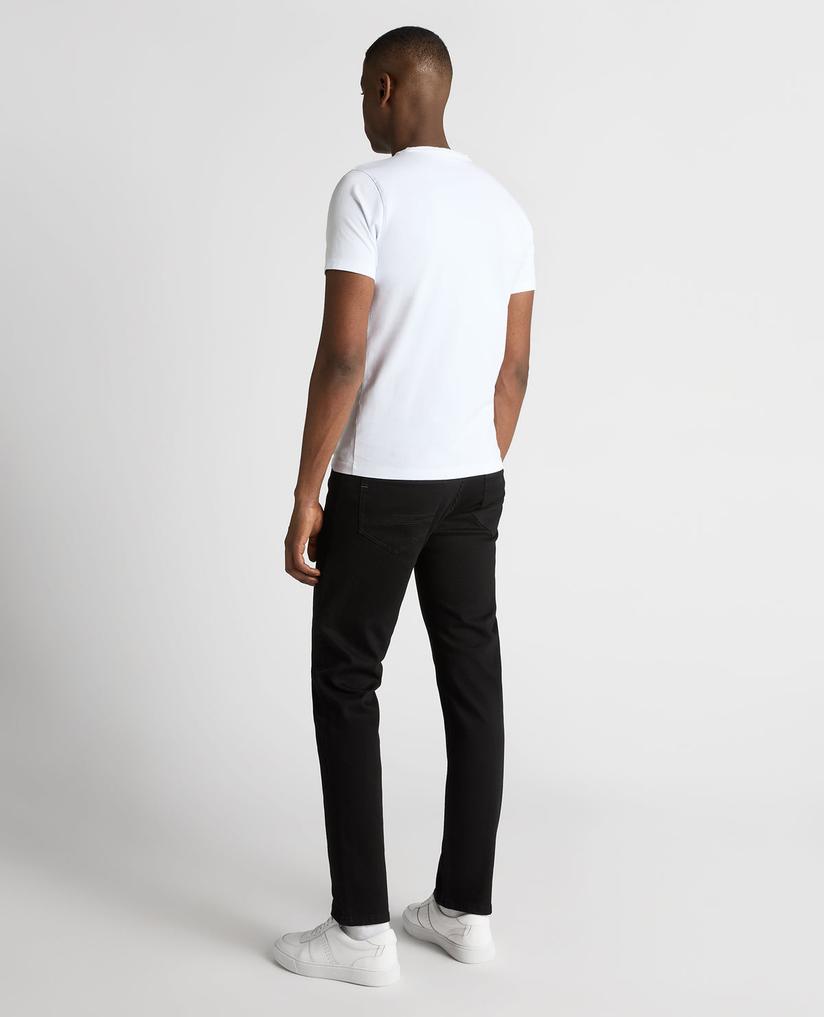 Man wearing a black Rogan Straight Leg Powerstretch Jean