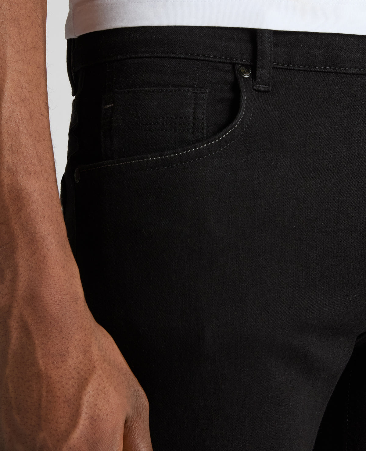 Man wearing a black Rogan Straight Leg Powerstretch Jean