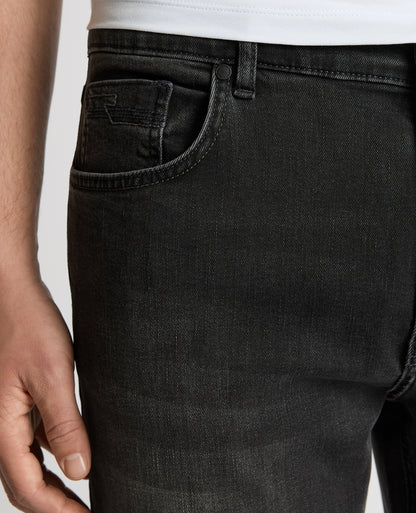 Man wearing a grey Rogan Dark Wash Straight Leg Jeans