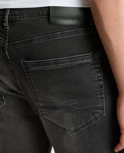 Man wearing a grey Rogan Dark Wash Straight Leg Jeans