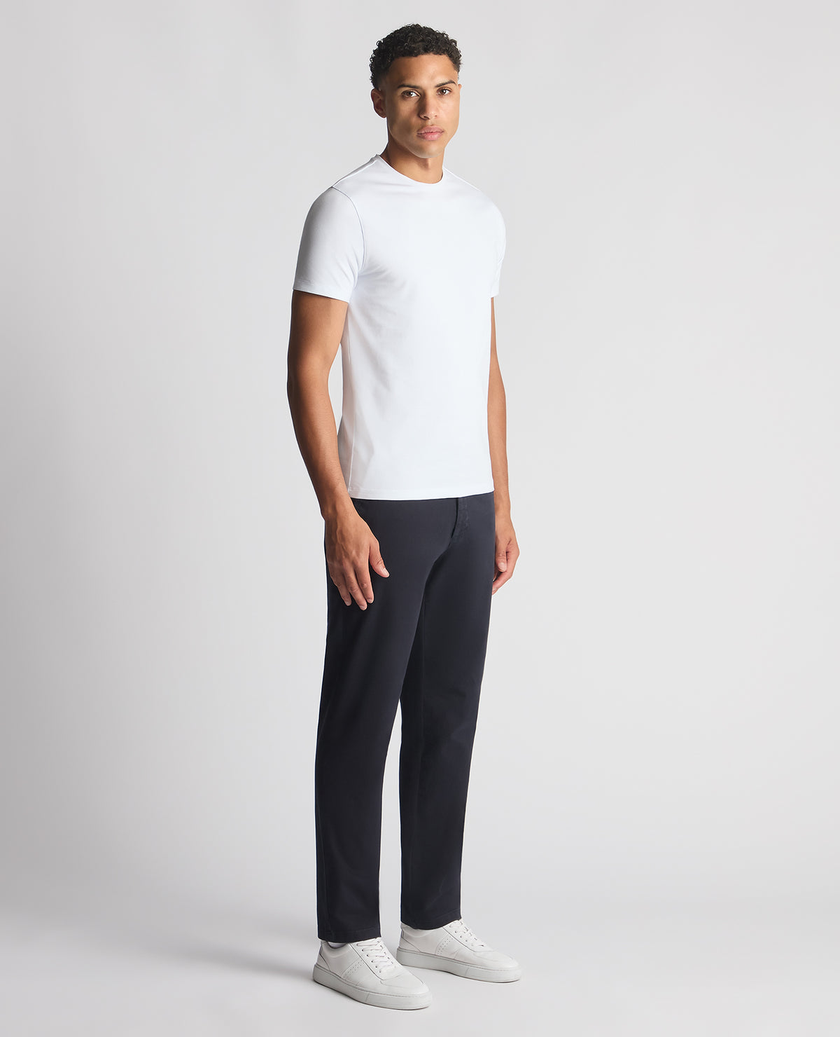 Man wearing a navy Straight Leg Cotton-Stretch Ronan Chino
