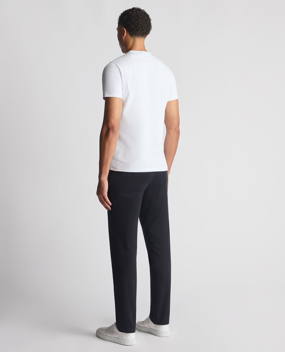 Man wearing a navy Straight Leg Cotton-Stretch Ronan Chino