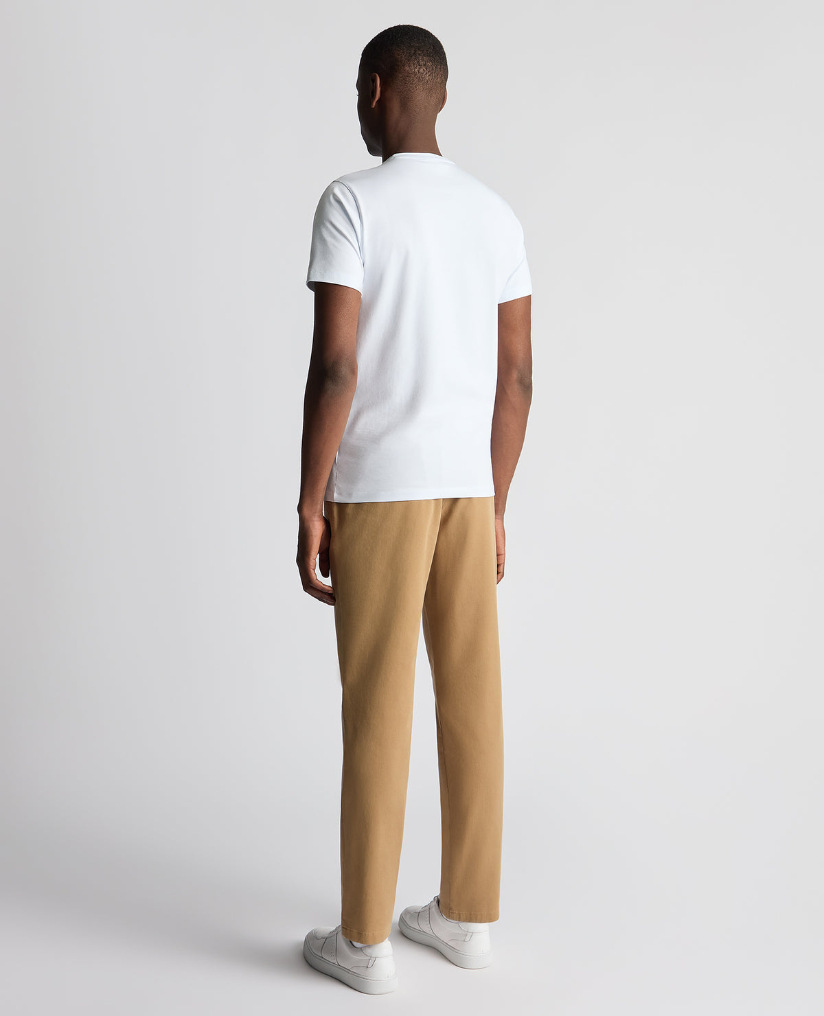 Man wearing a sand Straight Leg Cotton-Stretch Washed Chino
