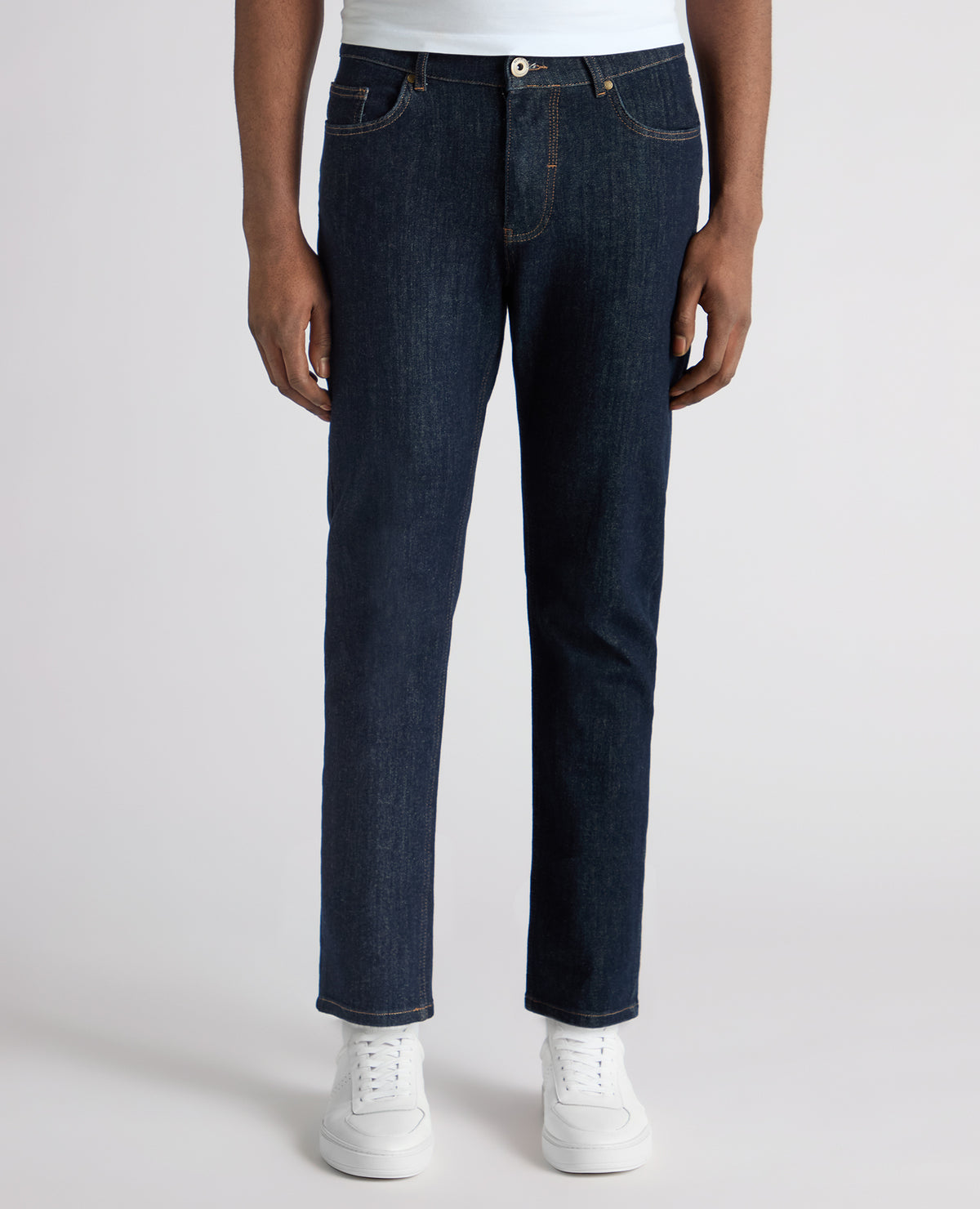 Man wearing a navy Roman Modern Straight Leg Jeans