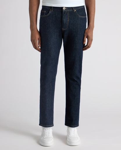 Man wearing a navy Roman Modern Straight Leg Jeans