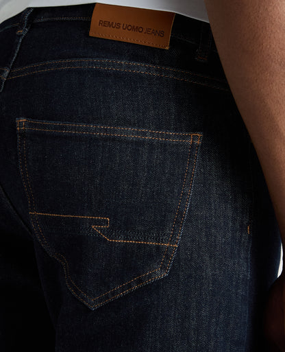 Man wearing a navy Roman Modern Straight Leg Jeans