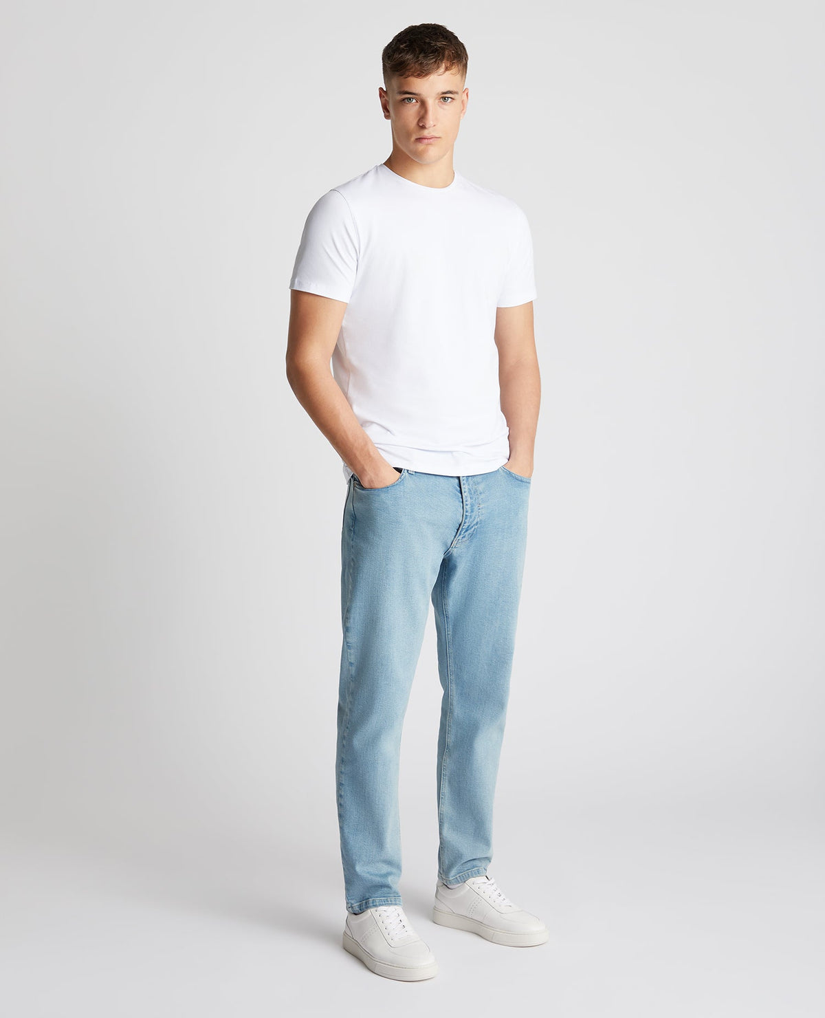 Man wearing a blue Roman Modern Straight Fit Comfort Stretch Jean