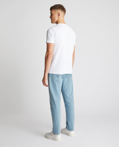 Man wearing a blue Roman Modern Straight Fit Comfort Stretch Jean